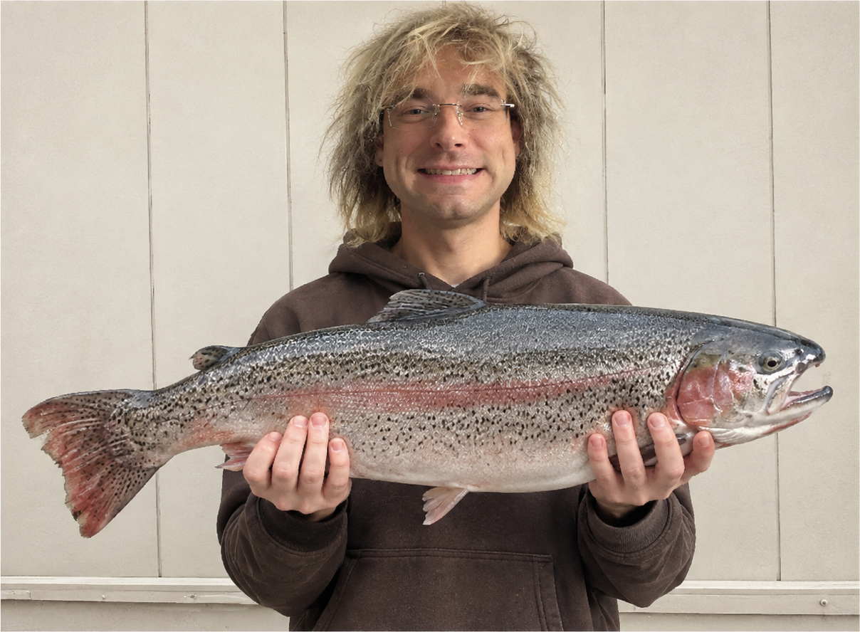 Our first Good Gardener of the Month smiling while holding a large fish